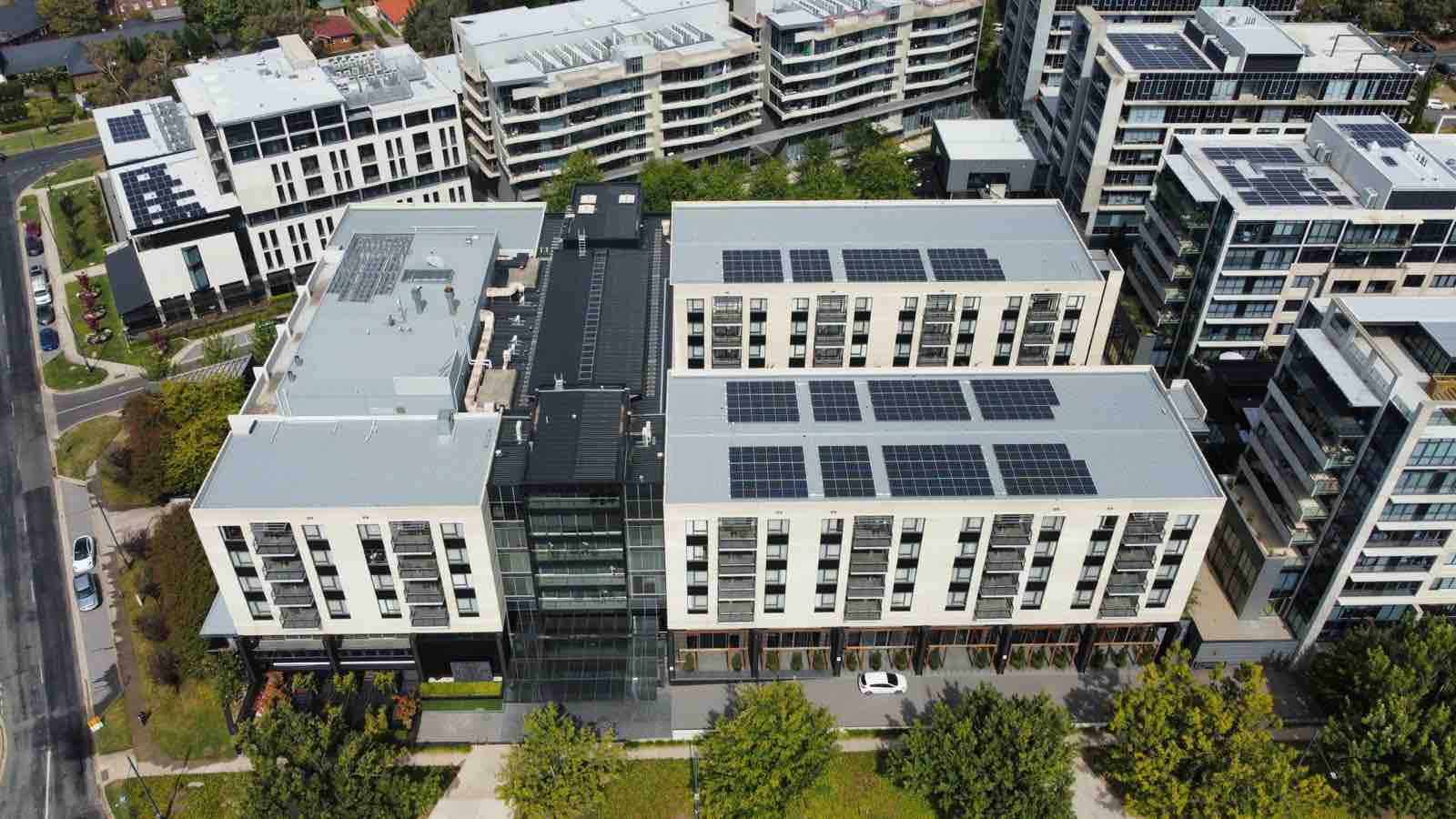 Aerial of Doma hotels and the National Archives rooftop solar arrays in the ACT