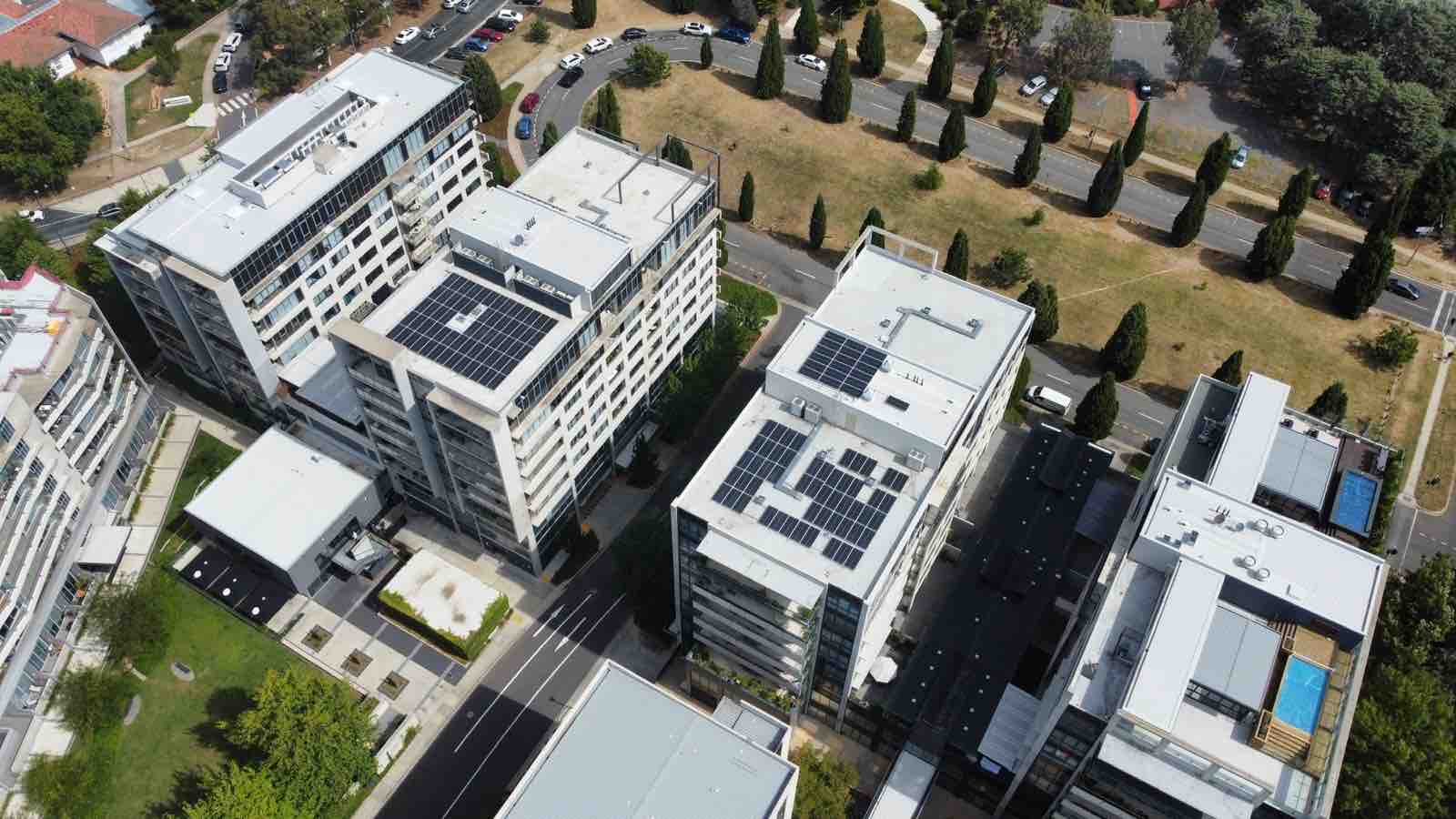 Aerial of Doma hotels and the National Archives rooftop solar arrays in the ACT