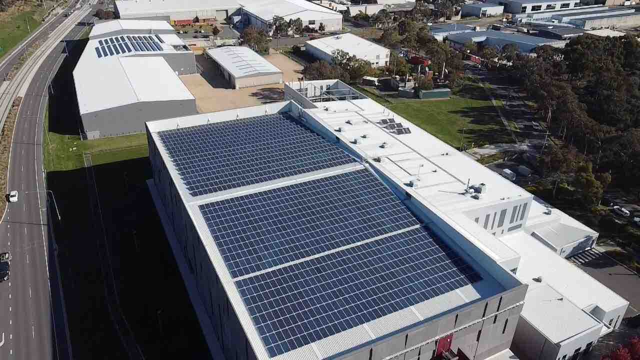 Aerial of Doma hotels and the National Archives rooftop solar arrays in the ACT